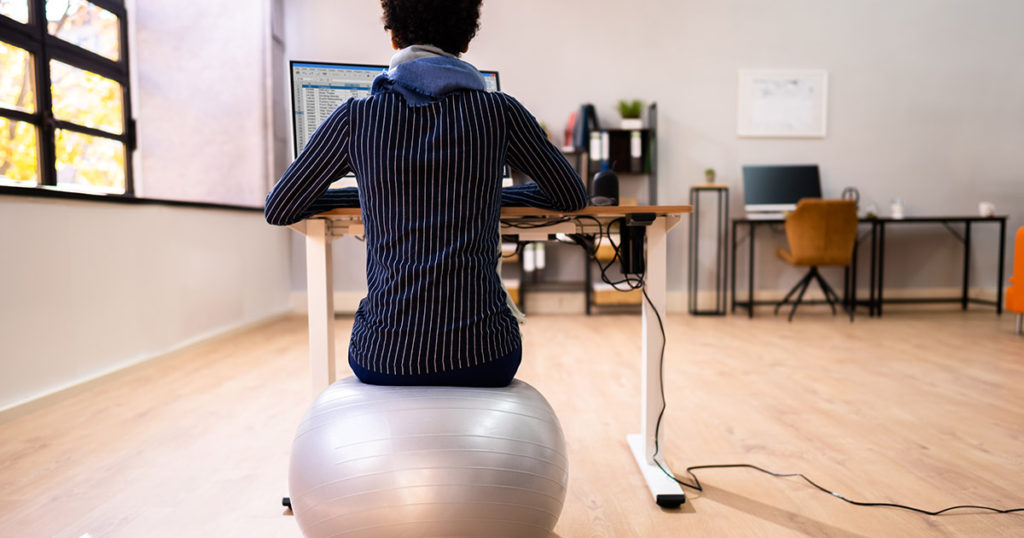 woman sitting on exercise ball